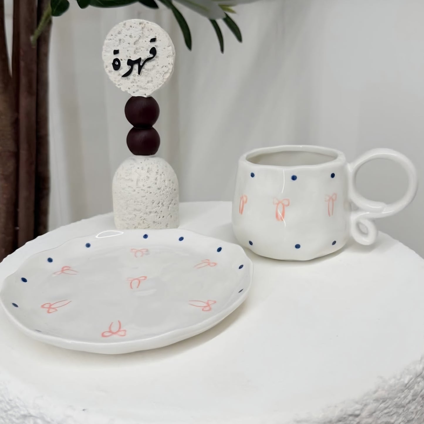 Special handle mug with pink bow and saucer