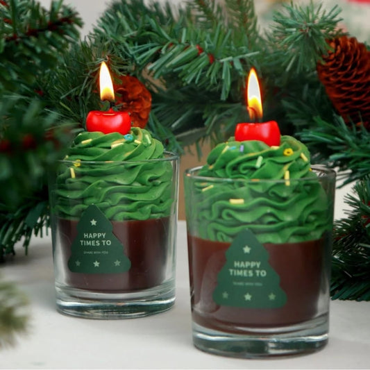 Christmas tree candle in vase with Cherry on top