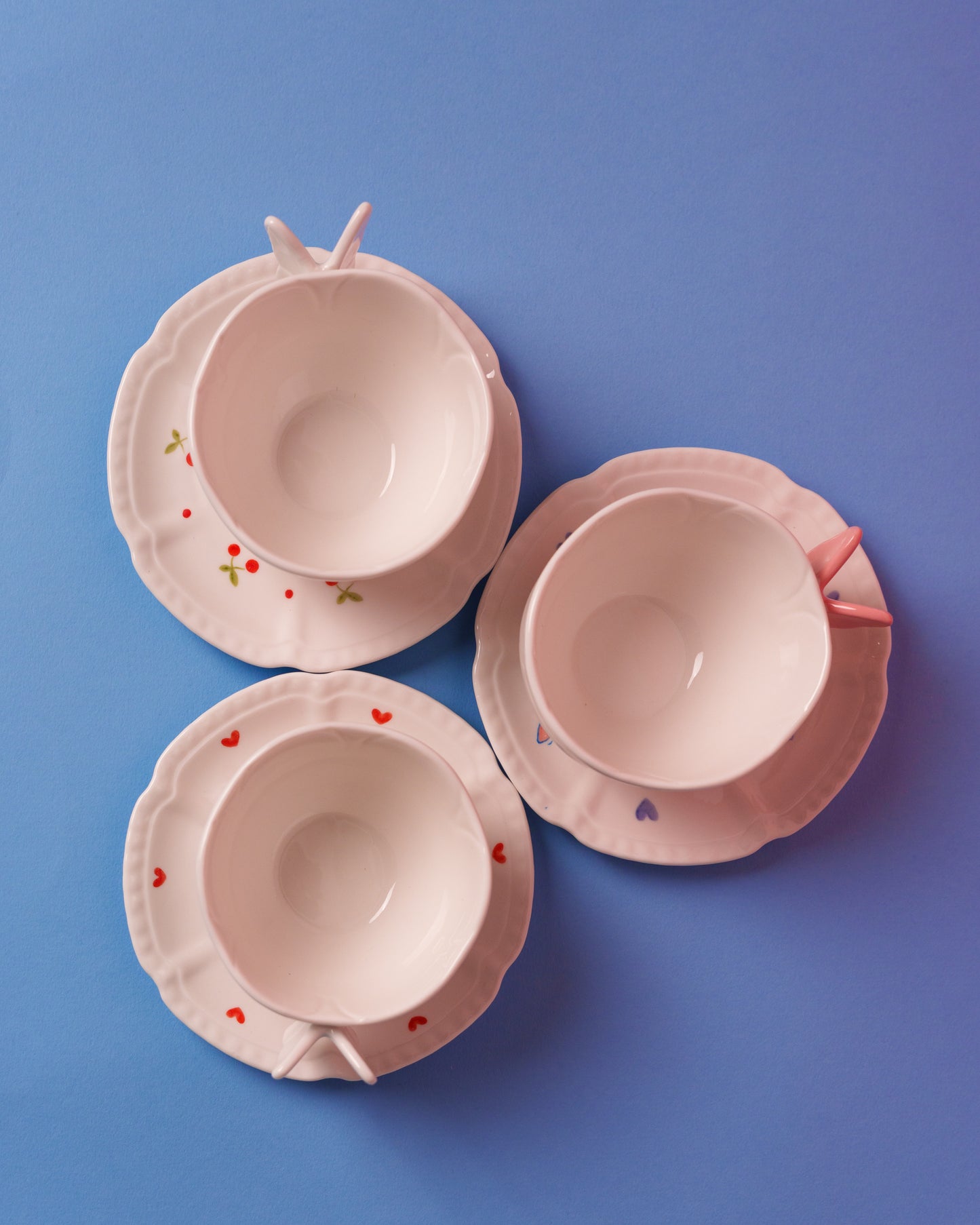 Mug with butterfly handle and saucer