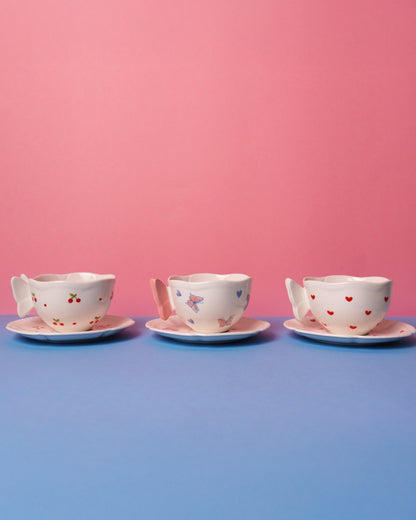 Mug with butterfly handle and saucer