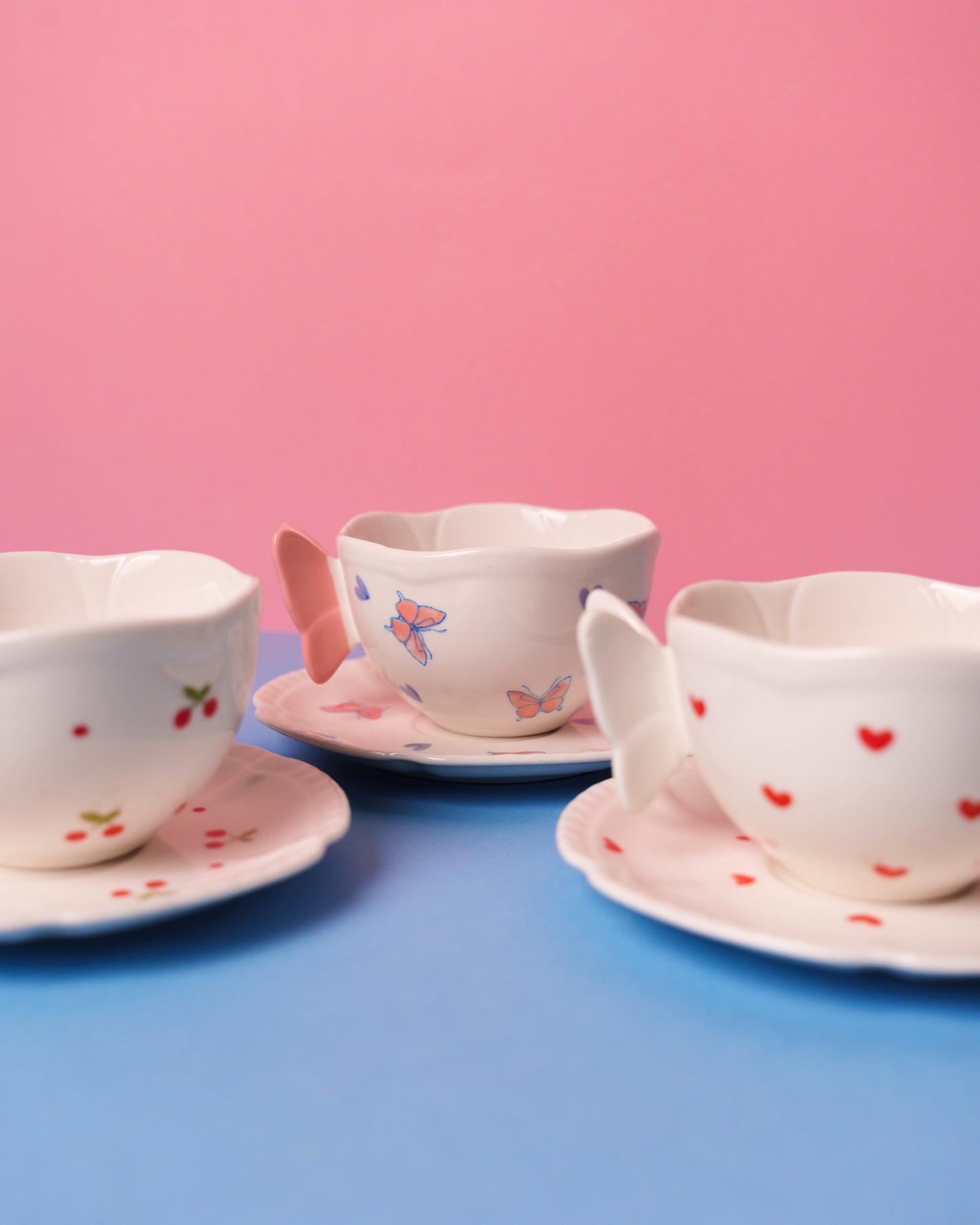 Mug with butterfly handle and saucer