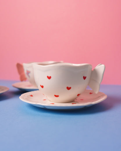 Mug with butterfly handle and saucer
