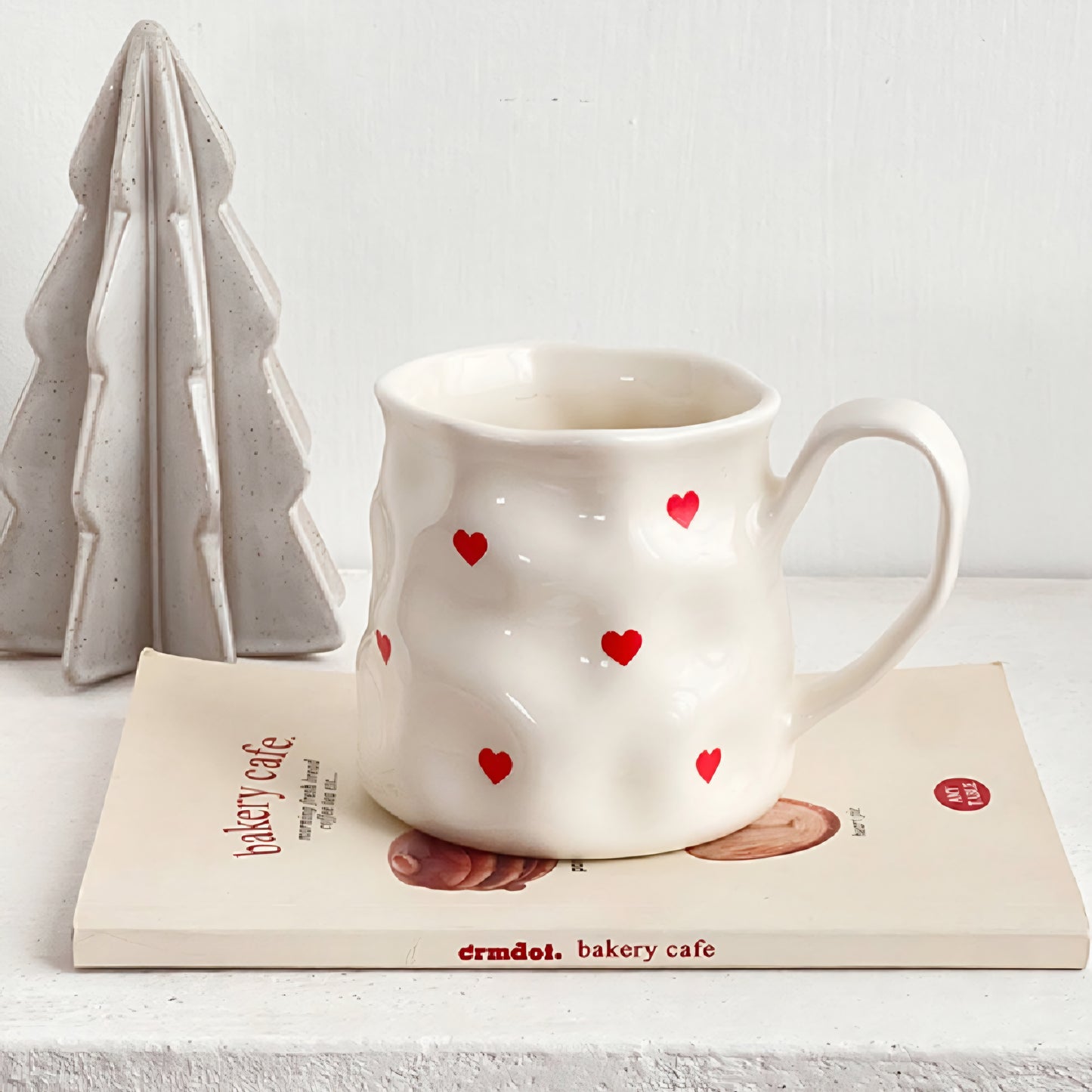 Big white mug with red hearts or bows