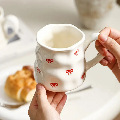 Big white mug with red hearts or bows