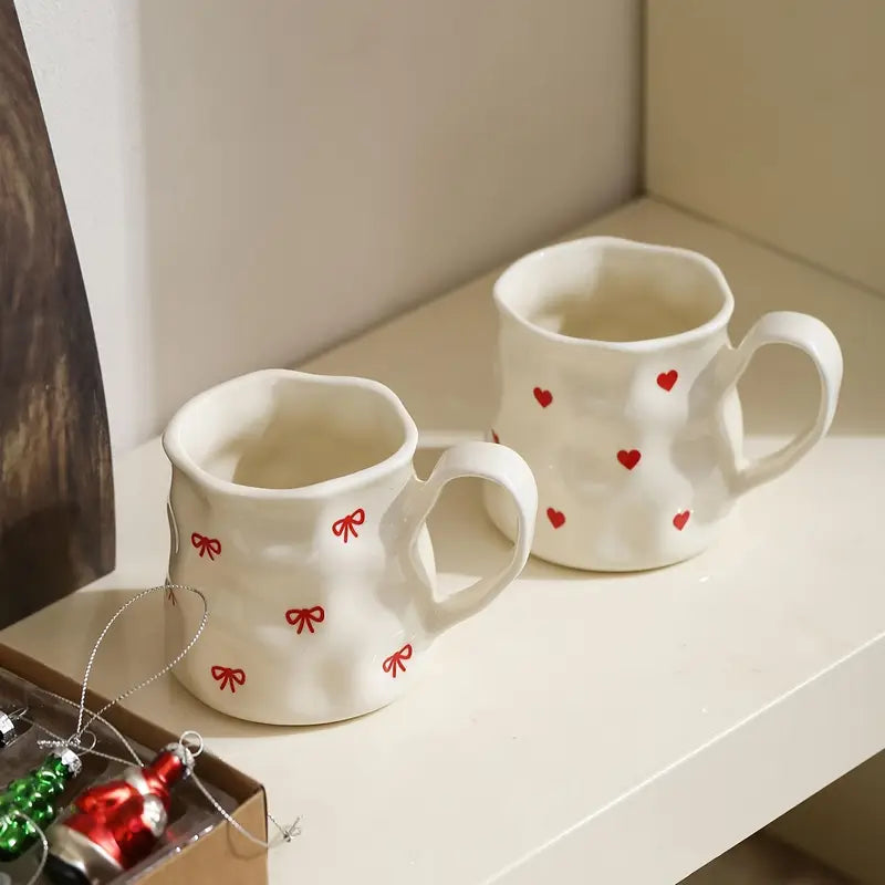 Big white mug with red hearts or bows