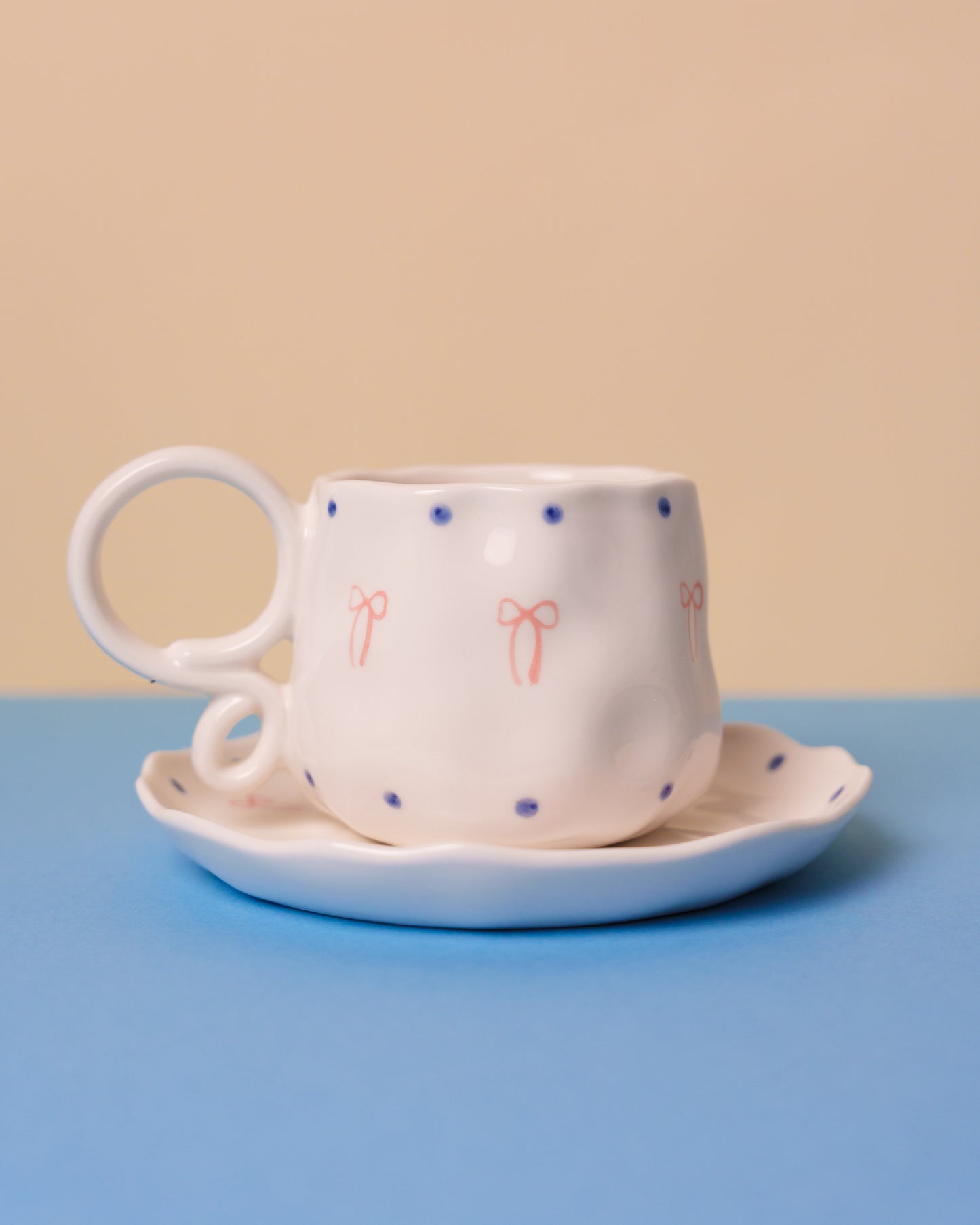 Special handle mug with pink bow and saucer