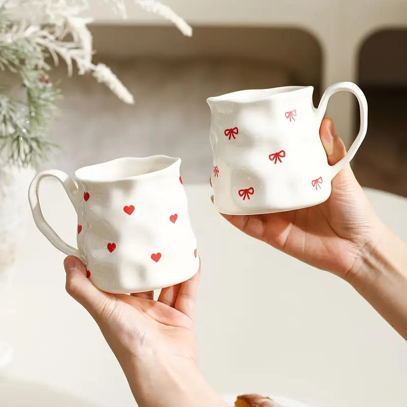 Big white mug with red hearts or bows